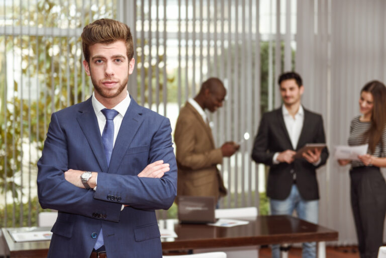 CEO standing in a boardroom representing leadership conviction and strategic clarity